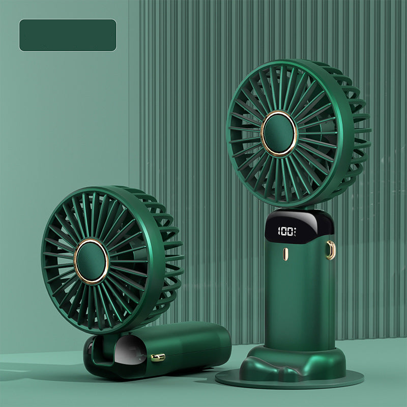 Two green handheld fans on a green background