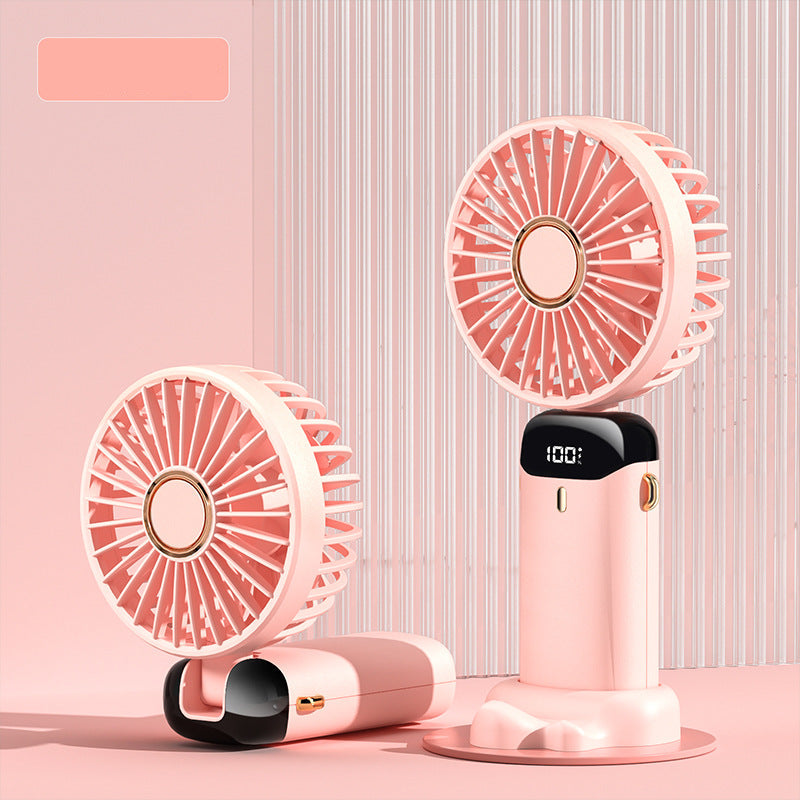 Two cherry blossom pink handheld fans on a pink background.