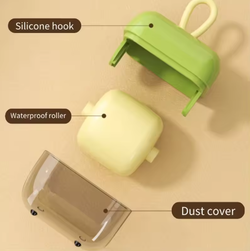 Green silicone hook, waterproof roller, and dust cover on a beige background