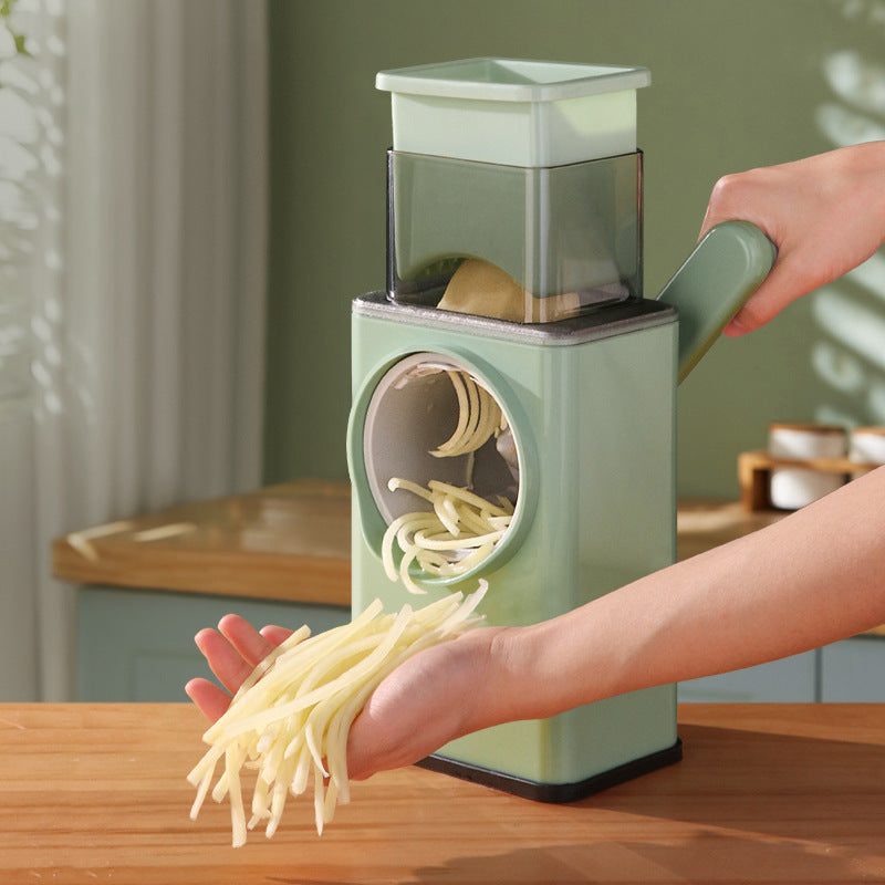 Person using a Vegetable Slicer and Cutter on a wooden table.