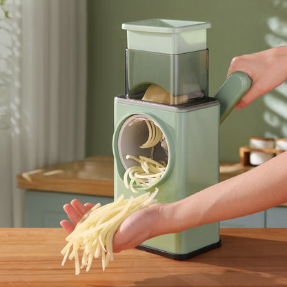 Person using a Vegetable Slicer and Cutter on a wooden table.